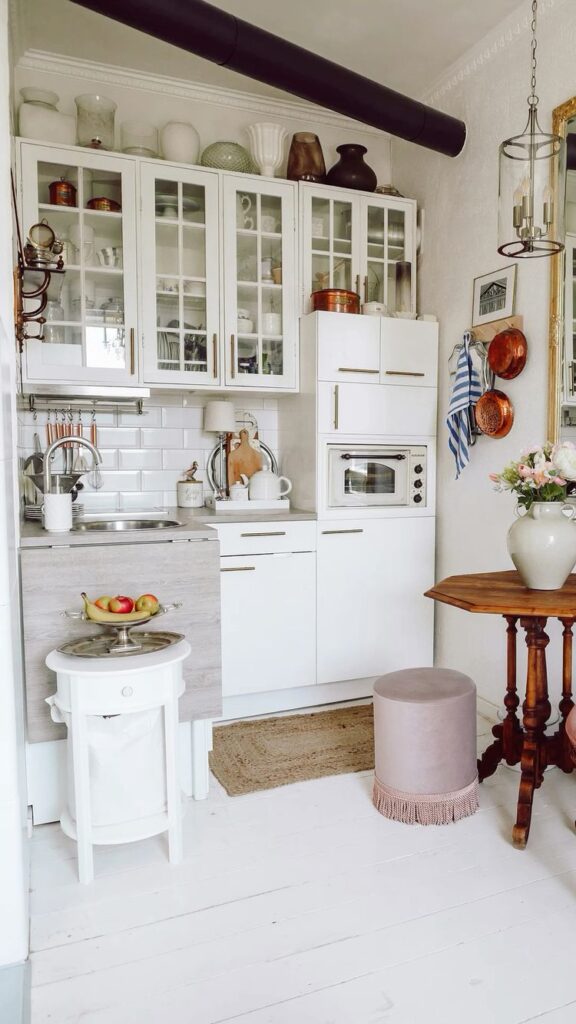 Small kitchen with a multi-functional island for storage.