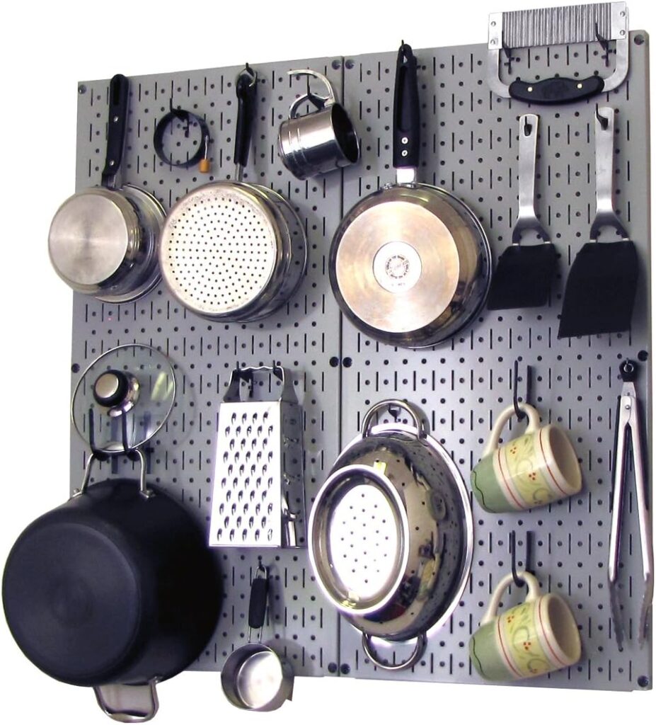 Kitchen pegboard used to organize utensils and kitchen tools